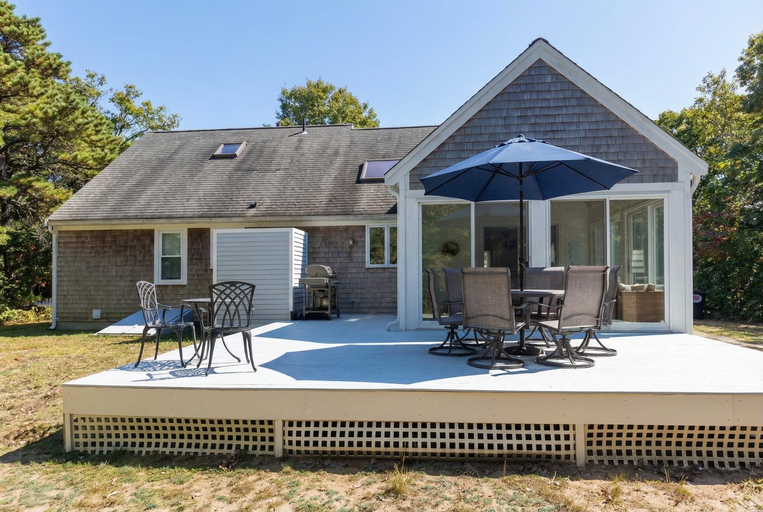 115 Wamsutta Road Eastham, MA 02642 - Photo 36 of 45 a front view of a house with a patio