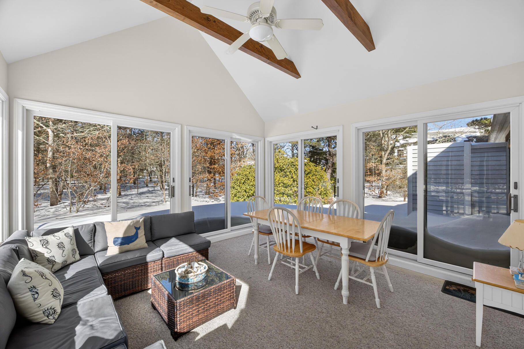 115 Wamsutta Road Eastham, MA 02642 - Photo 8 of 45 a dining room with furniture and large windows