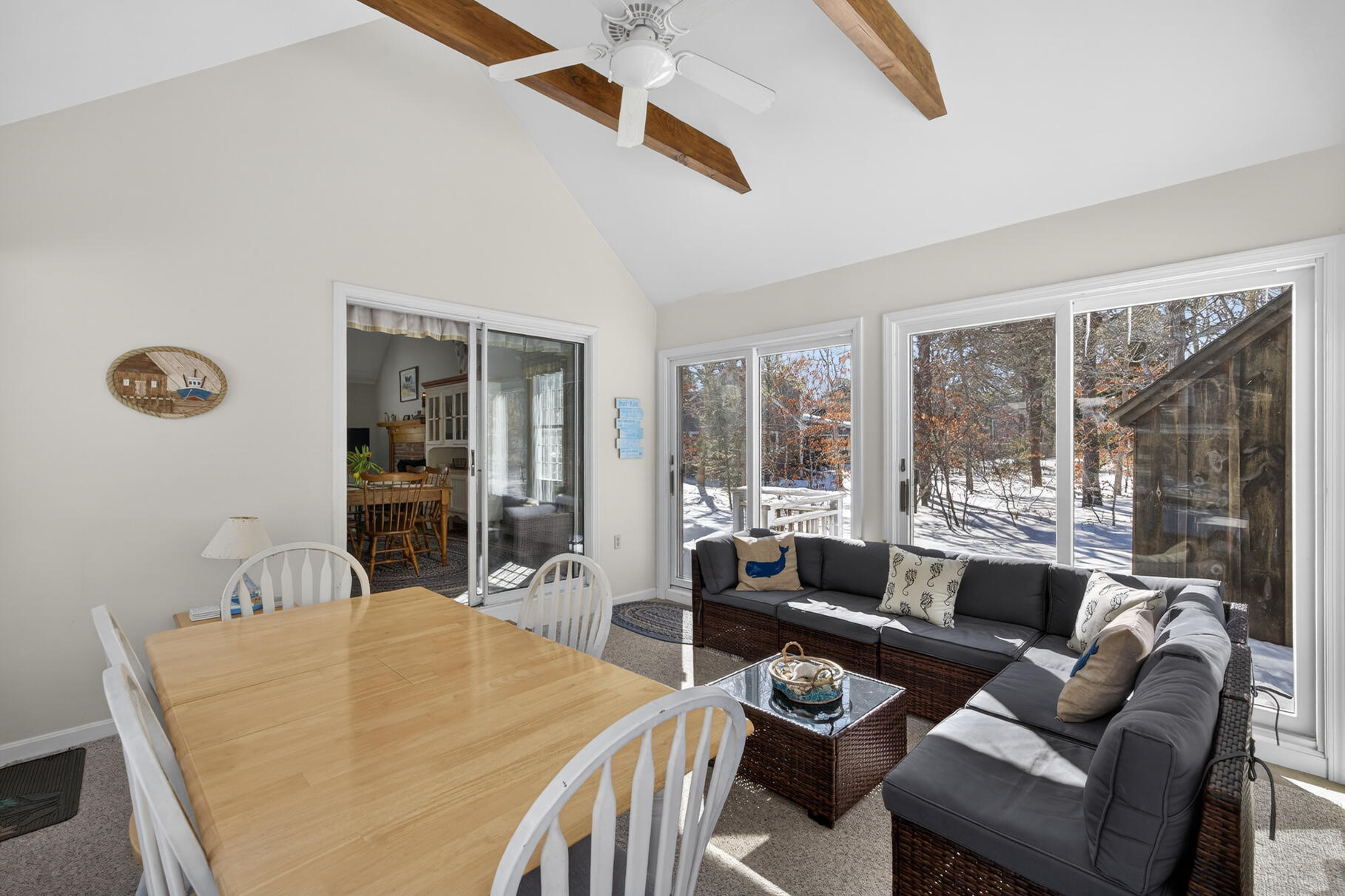 115 Wamsutta Road Eastham, MA 02642 - Photo 9 of 45 a living room with furniture and a large window