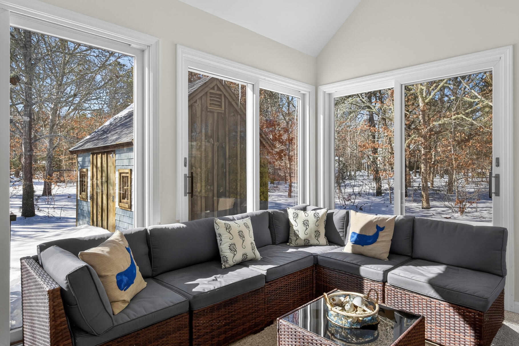 115 Wamsutta Road Eastham, MA 02642 - Photo 10 of 45 a living room with furniture and a large window