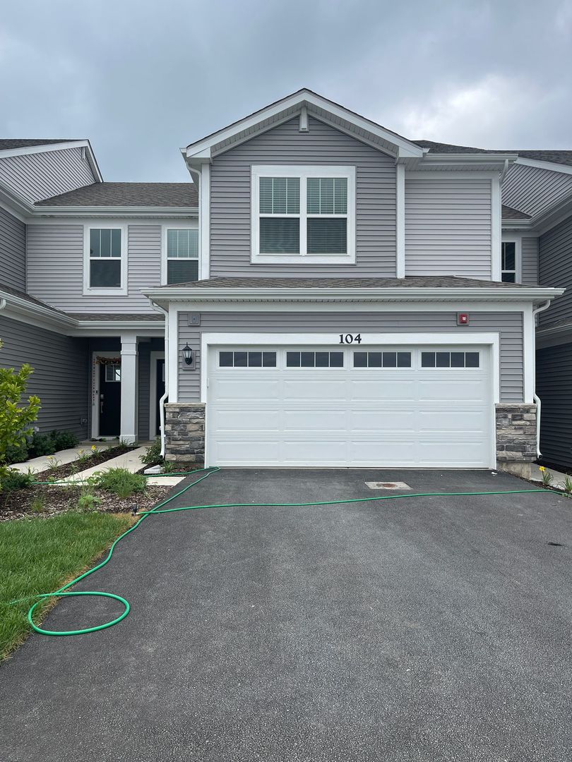 104 Henderson Street Oswego, IL 60543 - Photo 1 of 21 front view of a house with a yard