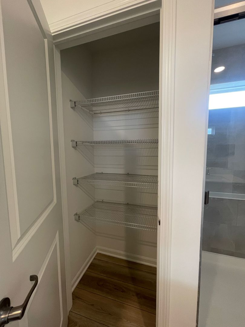 104 Henderson Street Oswego, IL 60543 - Photo 13 of 21 a view of walk in closet