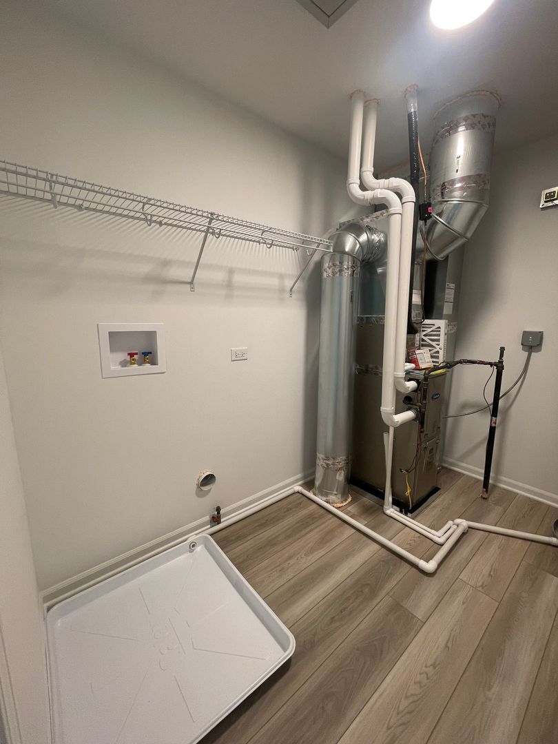 104 Henderson Street Oswego, IL 60543 - Photo 17 of 21 a view of a room with gym equipment