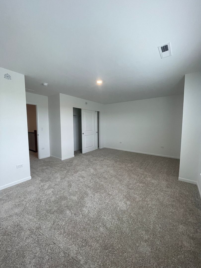 104 Henderson Street Oswego, IL 60543 - Photo 5 of 21 a view of an empty room