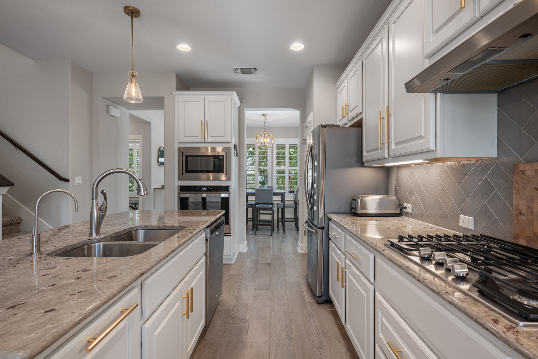 5409 Fox Wing Way Austin, TX 78747 - Photo 6 of 26 Culinary delights await in this modern kitchen with extensive counter space and stainless steel appliances.