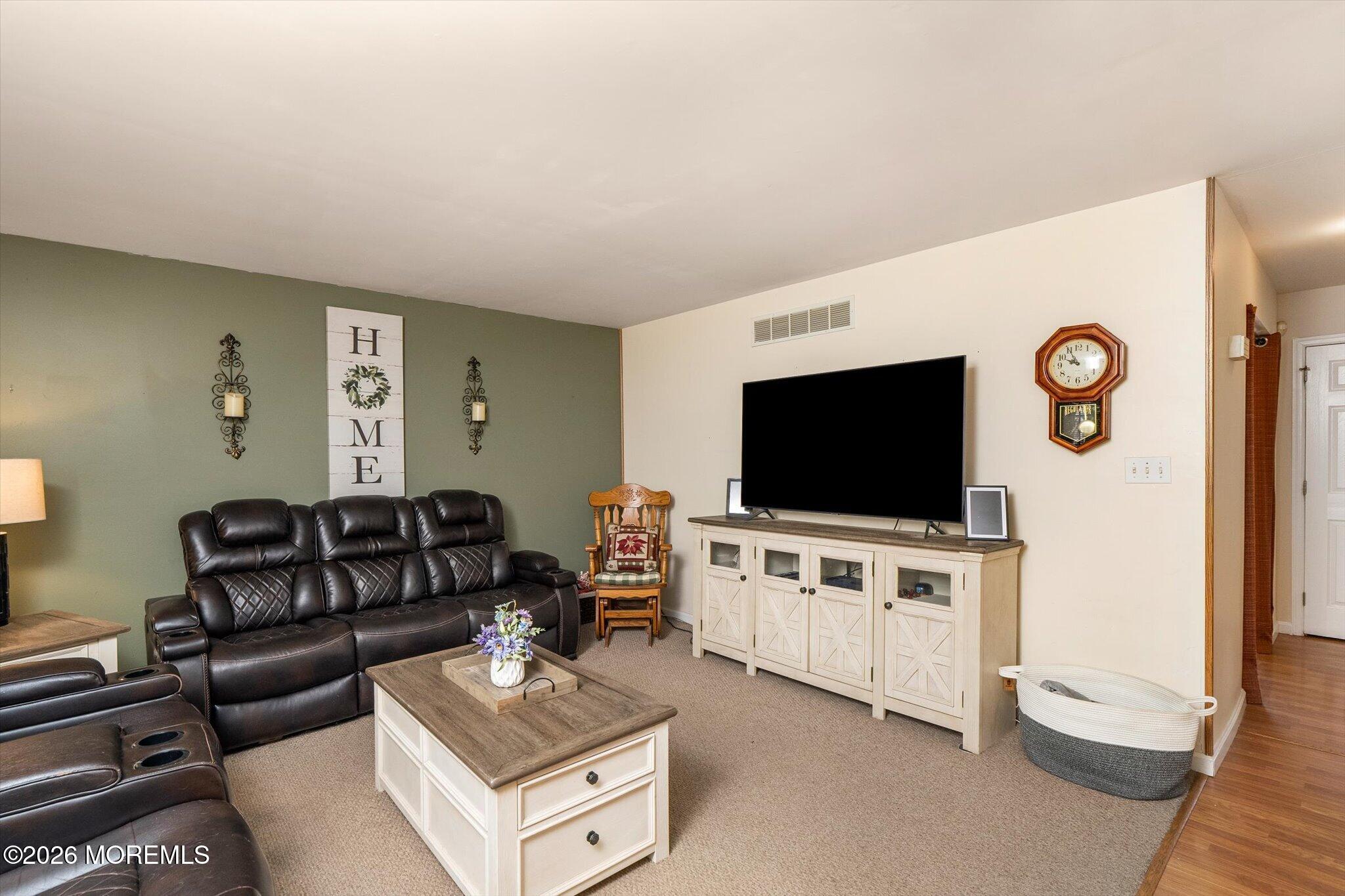 208 North Success Road Cream Ridge, NJ 08514 - Photo 9 of 40 a living room with furniture and a flat screen tv