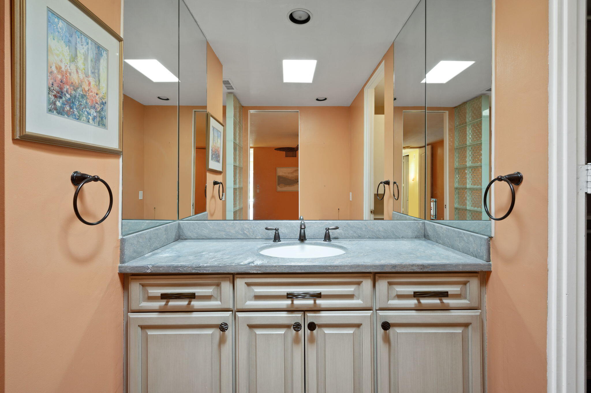 77675 Seminole Road Indian Wells, CA 92210 - Photo 24 of 40 a bathroom with a granite countertop sink and a mirror