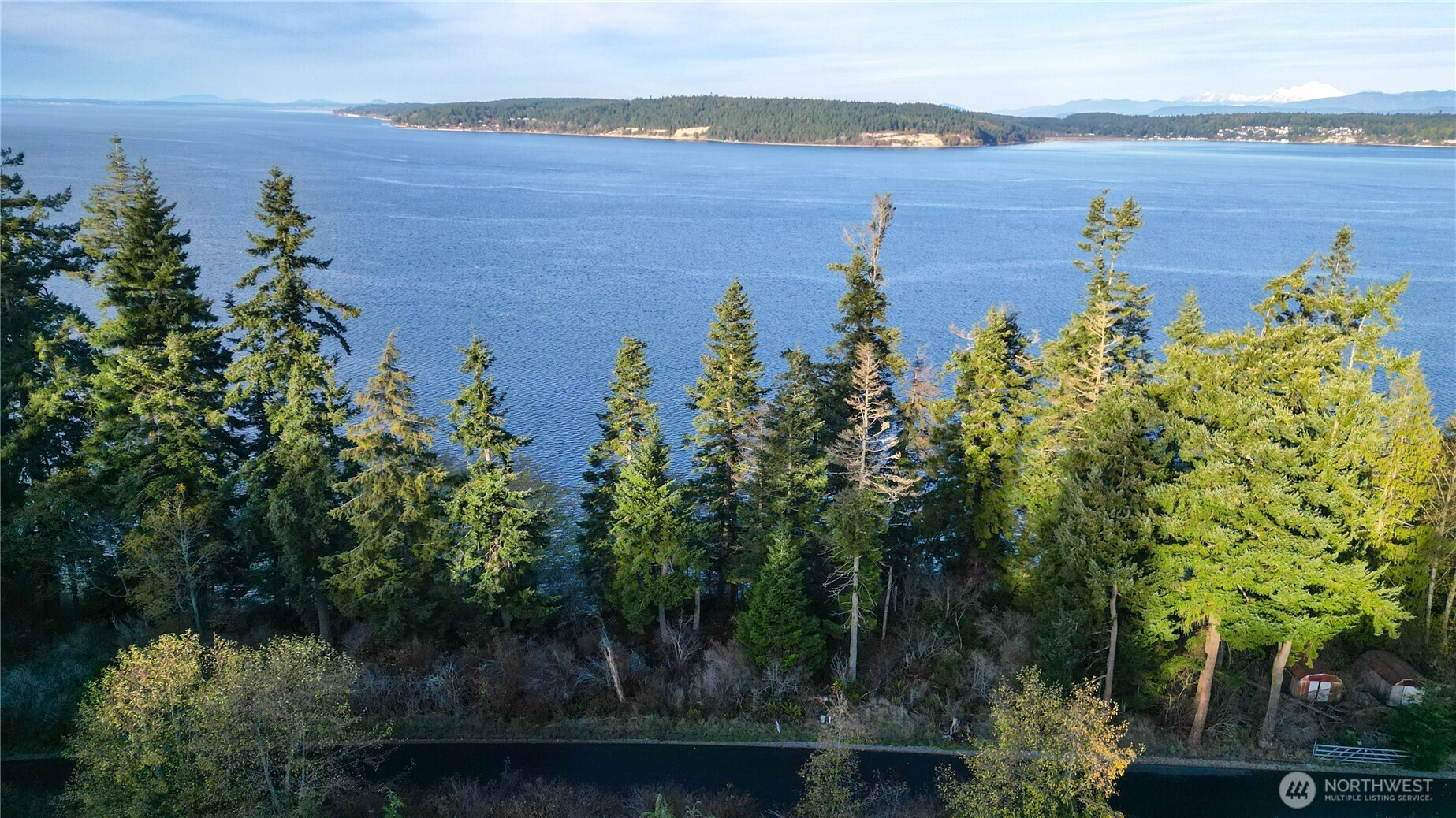 -xxx Fox Spit Road Langley, WA 98260 - Photo 3 of 9 an aerial view of lake with residential house with outdoor space and seating