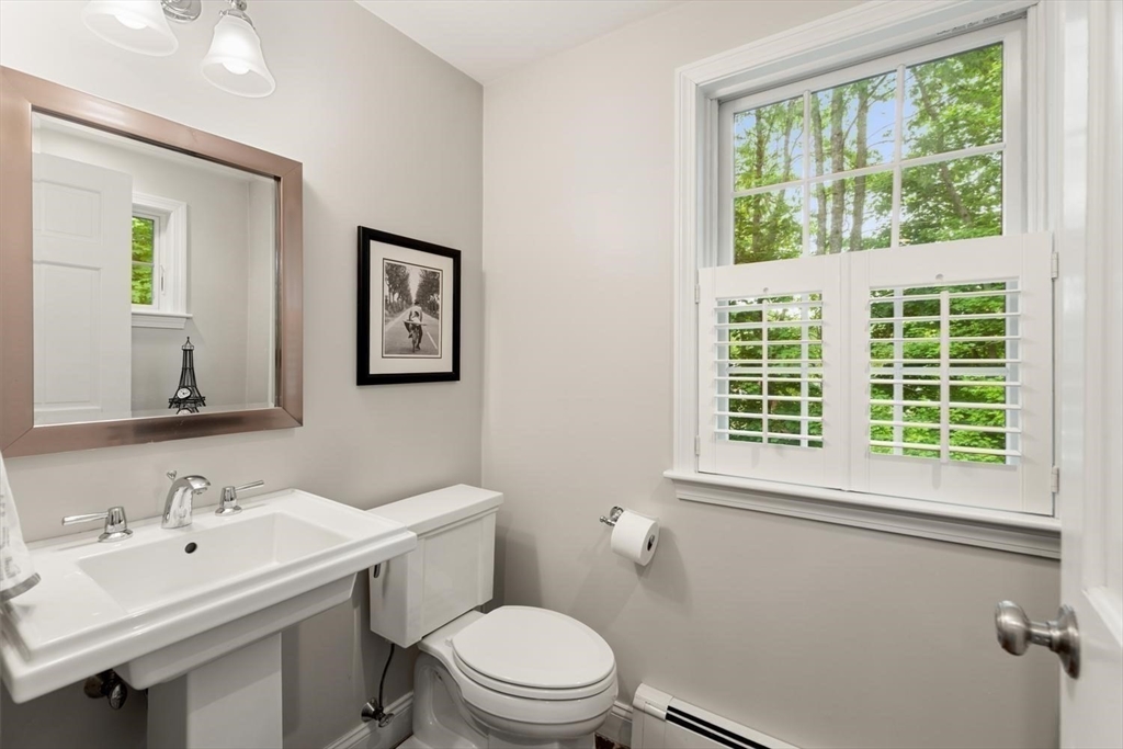 105 Thornberry Road Winchester, MA 01890 - Photo 10 of 35 a bathroom with a sink a toilet and a window