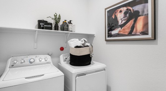 1220 Crumpton Drive Pflugerville, TX 78660 - Photo 13 of 34 a utility room with dryer and washer