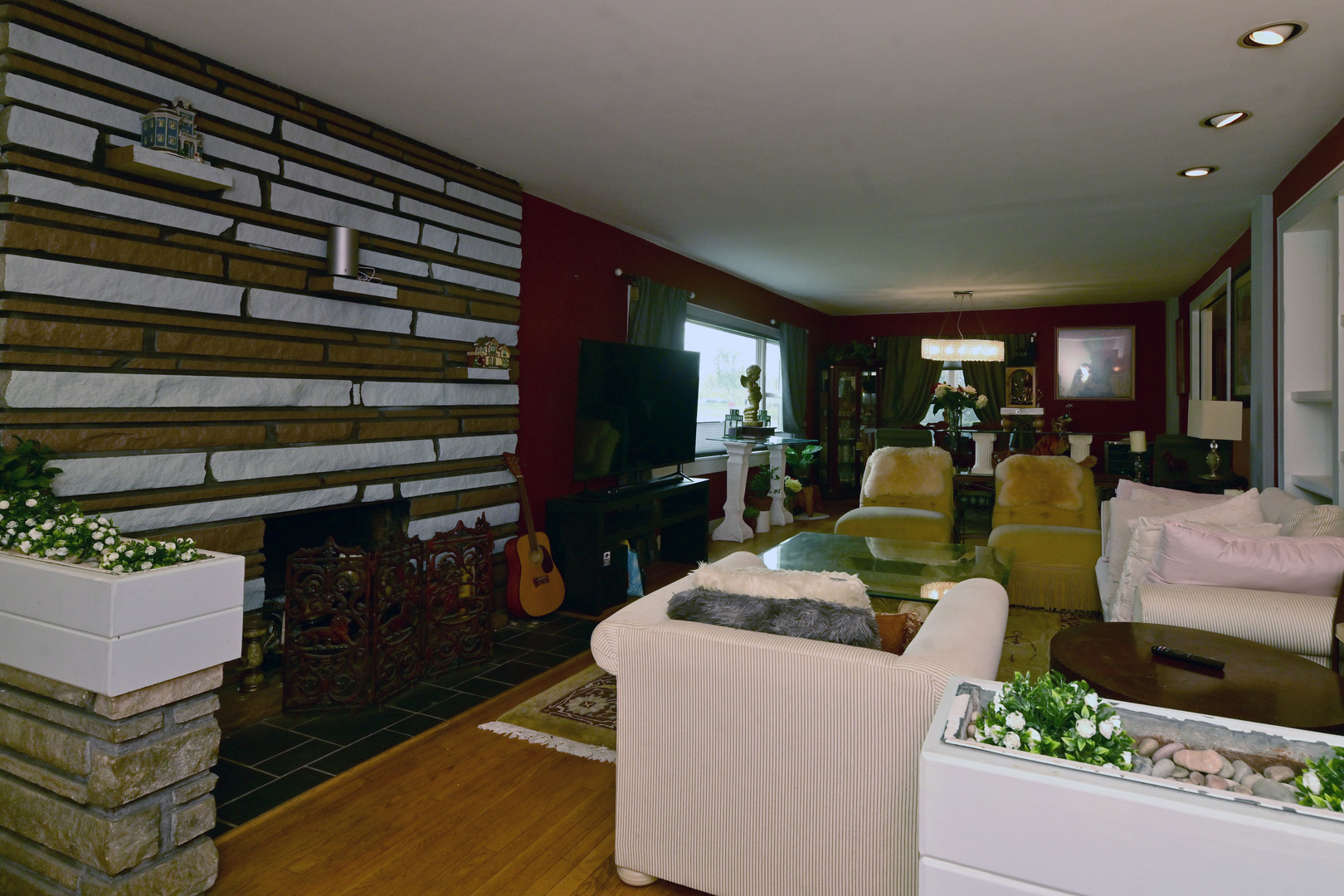 2140 Beechnut Road Northbrook, IL 60062 - Photo 14 of 33 a living room with furniture a flat screen tv and a floor to ceiling window