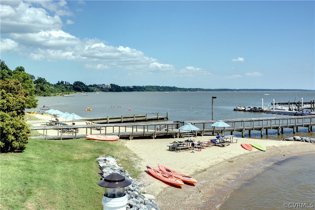 104-8 River Bluffs Williamsburg, VA 23185 - Photo 7 of 14 a view of swimming pool with outdoor seating and lake view