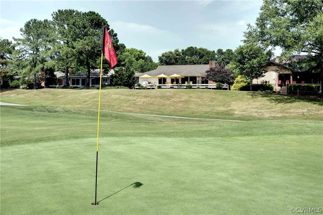 104-8 River Bluffs Williamsburg, VA 23185 - Photo 9 of 14 a front view of a house with a yard and trees