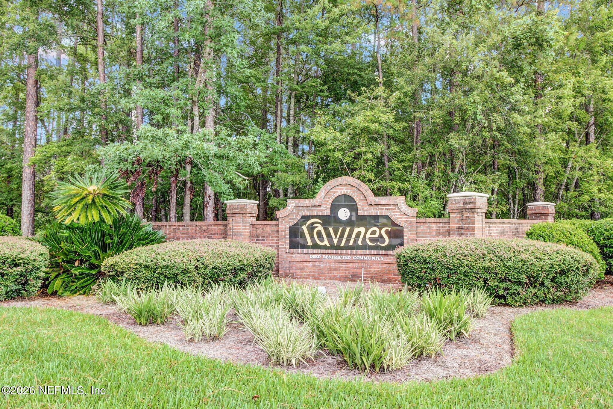 3165 Ravines Road, Unit 3601 Middleburg, FL 32068 - Photo 4 of 23 a view of outdoor space with signage and flags