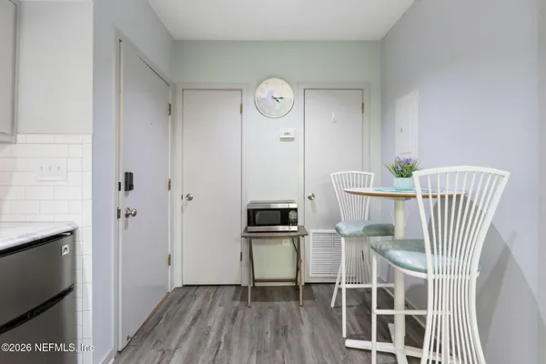 a view of a room with wooden floor and workspace