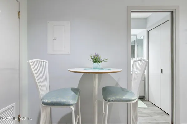a view of kitchen with furniture and wooden floor