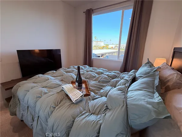 a white toilet sitting next to a white sink