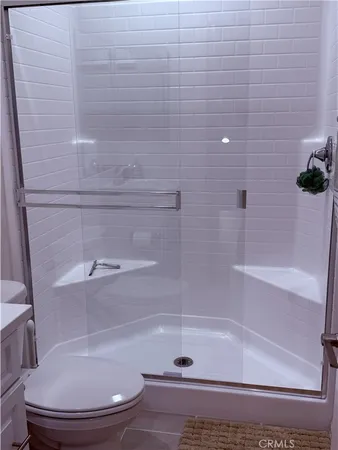 a living room with a couch and a piano