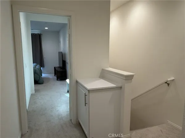 a bedroom with a bed and a mirror