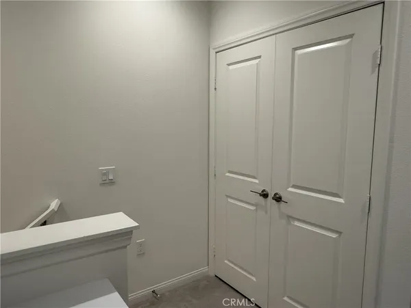 a bed room with a bed and a television