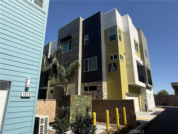 a view of living room with furniture and flowers