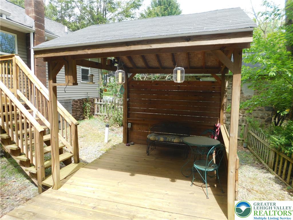 41 Reeder Street Mount Pocono, PA 18344 - Photo 9 of 41 An inviting covered deck space, perfect for outdoor dining, extends from the home's exterior.