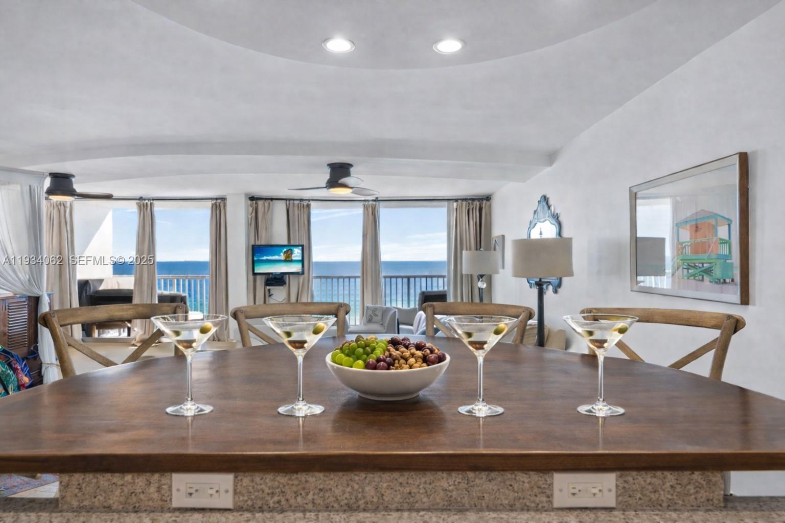 400 North Surf Road, Unit 905 Hollywood, FL 33019 - Photo 2 of 24 a view of a dining room with furniture