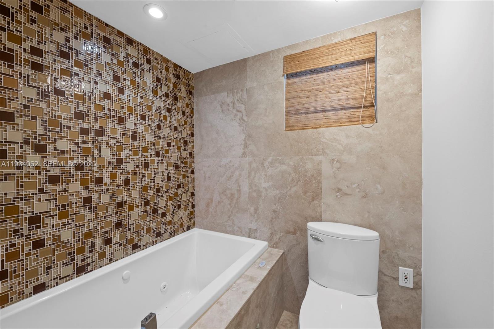 400 North Surf Road, Unit 905 Hollywood, FL 33019 - Photo 23 of 24 a bathroom with a toilet and a shower