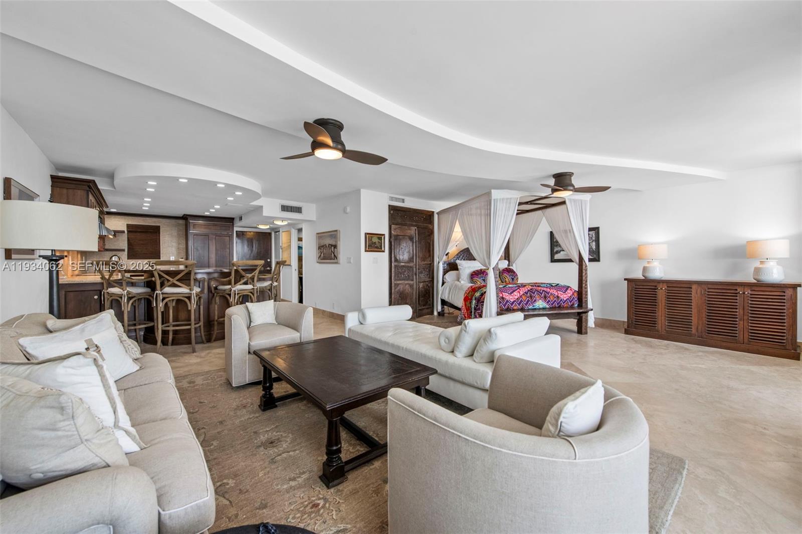 400 North Surf Road, Unit 905 Hollywood, FL 33019 - Photo 10 of 24 a living room with furniture and kitchen view