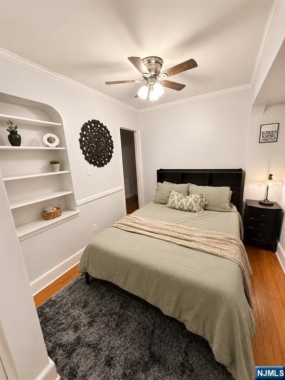 100 Prospect Avenue, Unit 5H Hackensack, NJ 07601 - Photo 13 of 17 a bedroom with a bed and a window