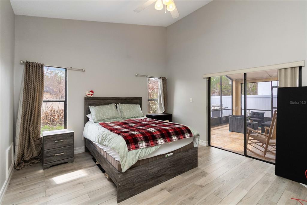 1647 Riveredge Road Oviedo, FL 32766 - Photo 12 of 28 a bedroom with a bed and wooden floor