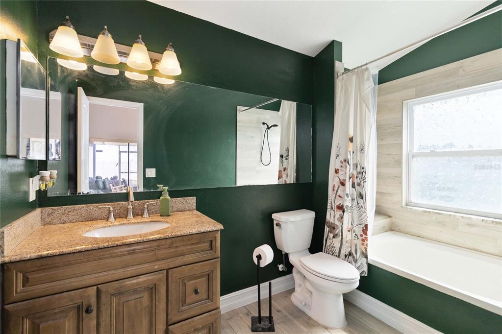 1647 Riveredge Road Oviedo, FL 32766 - Photo 14 of 28 a bathroom with a sink a toilet and a bathtub