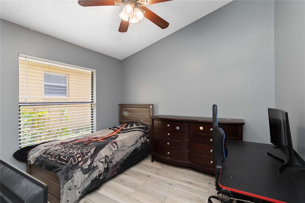 1647 Riveredge Road Oviedo, FL 32766 - Photo 15 of 28 a bedroom with a bed and a flat tv screen