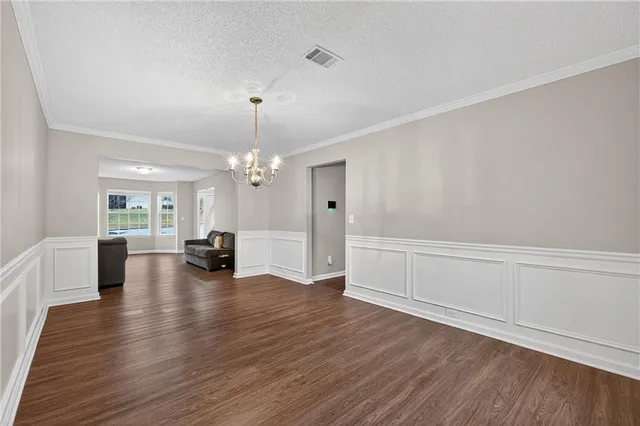 a view of a livingroom with hardwood floor and a ceiling fan
