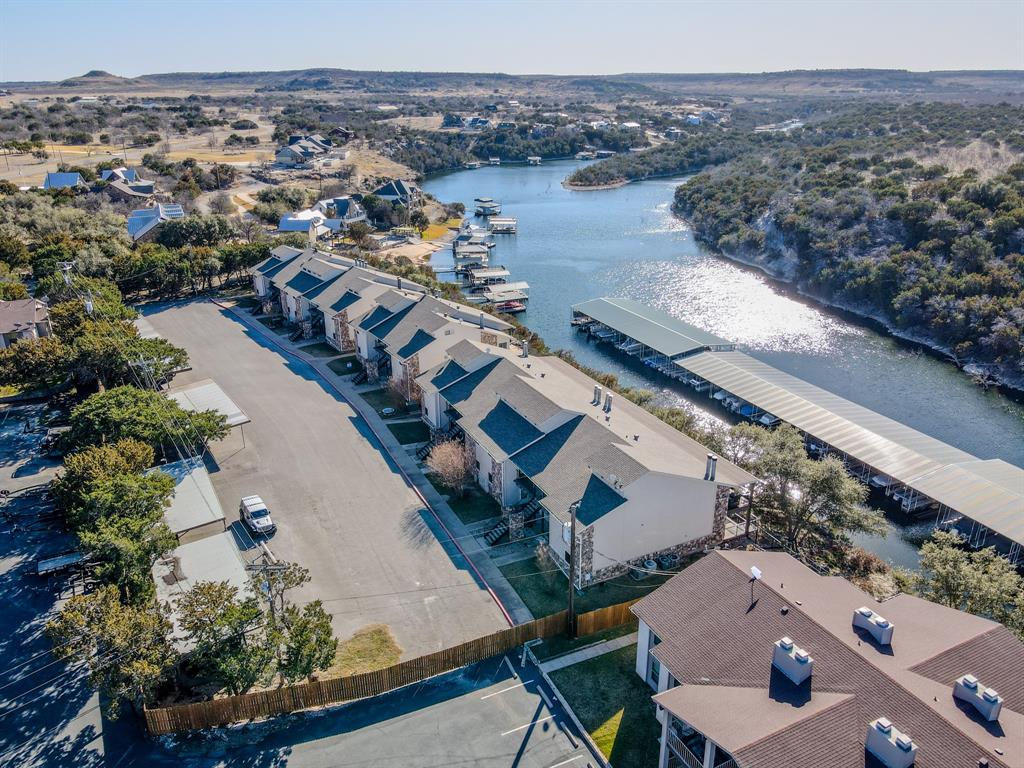 3037 Hells Gate Loop, Unit C208 Strawn, TX 76475 - Photo 2 of 23 an aerial view of house with yard