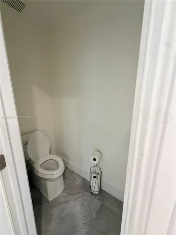 a bathroom with a sink and toilet