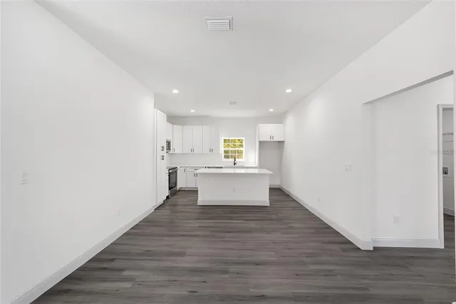 a view of kitchen with wooden floor