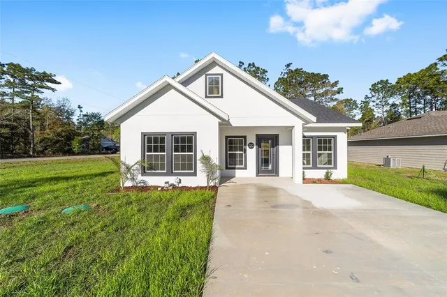 front view of a house with a yard