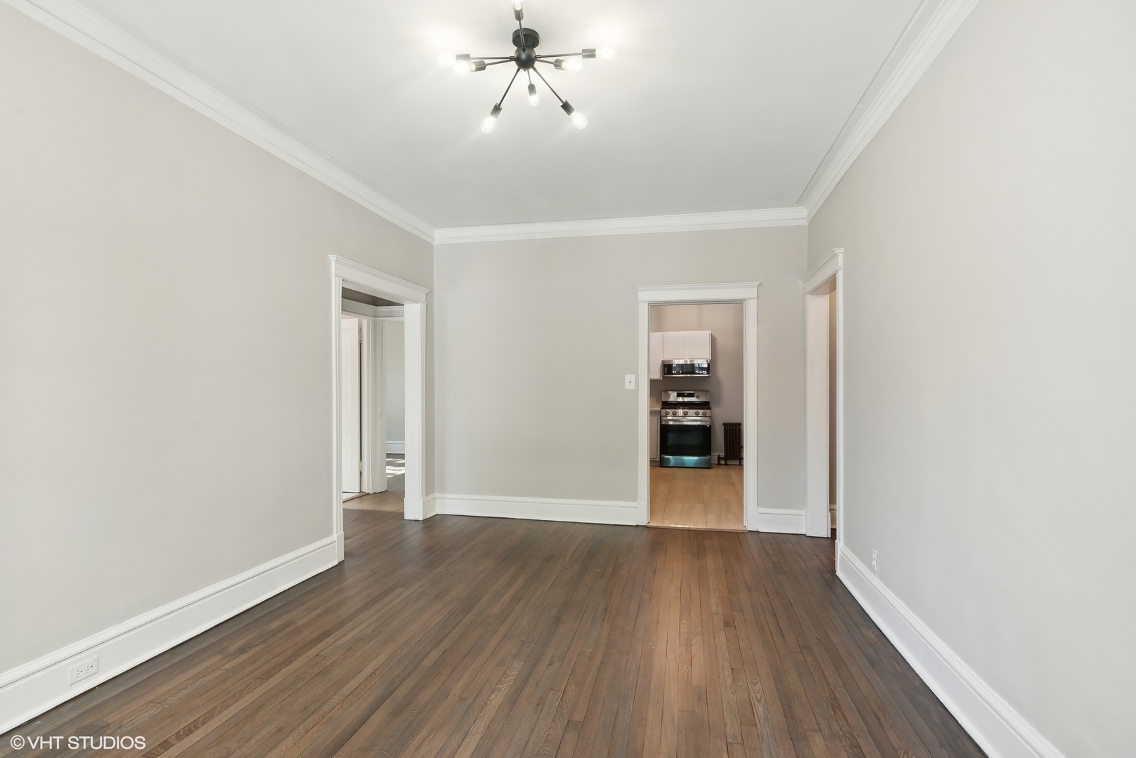 501 West Belmont Avenue, Unit 1 Chicago, IL 60657 - Photo 13 of 17 a view of an empty room with wooden floor