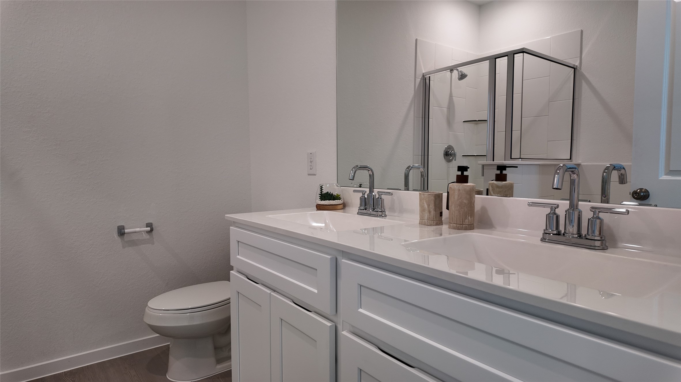 15023 Rustic Moon Road Conroe, TX 77302 - Photo 15 of 18 a bathroom with a granite countertop toilet sink and mirror