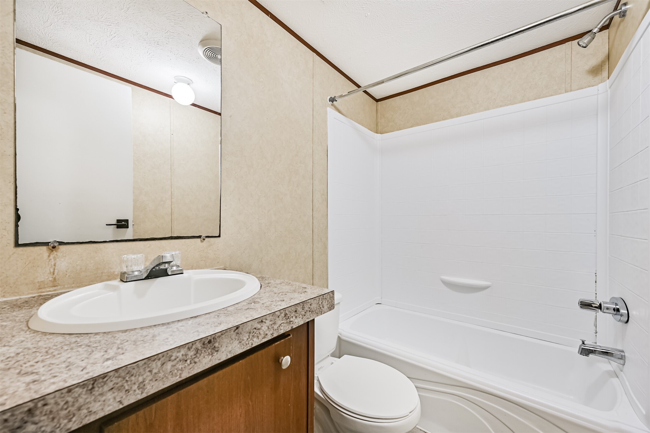 4702 10th Street Bacliff, TX 77518 - Photo 24 of 33 a bathroom with a granite countertop sink a toilet and shower