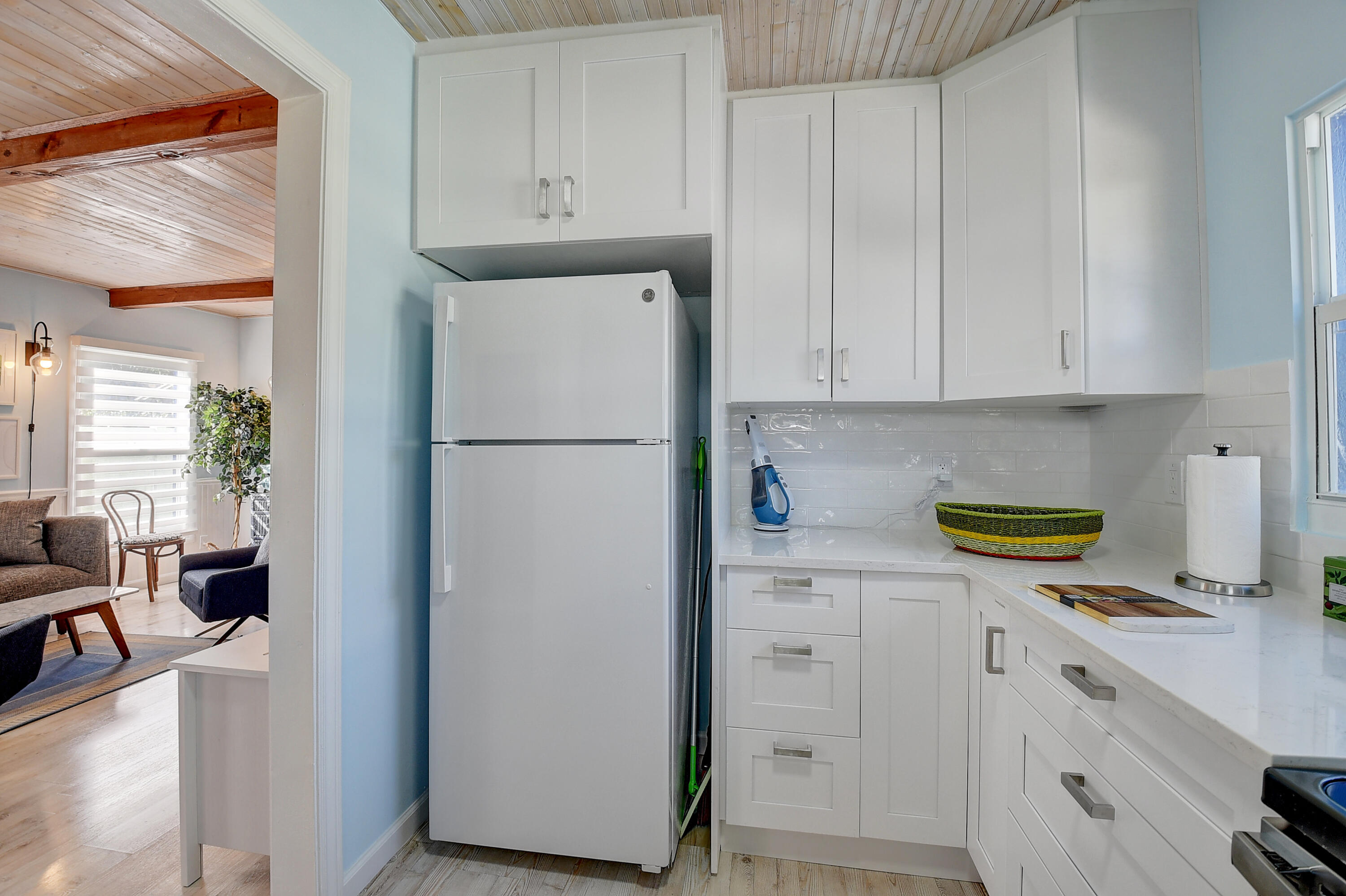 212 Southwest 1st Avenue Delray Beach, FL 33444 - Photo 12 of 15 a kitchen with refrigerator and cabinets