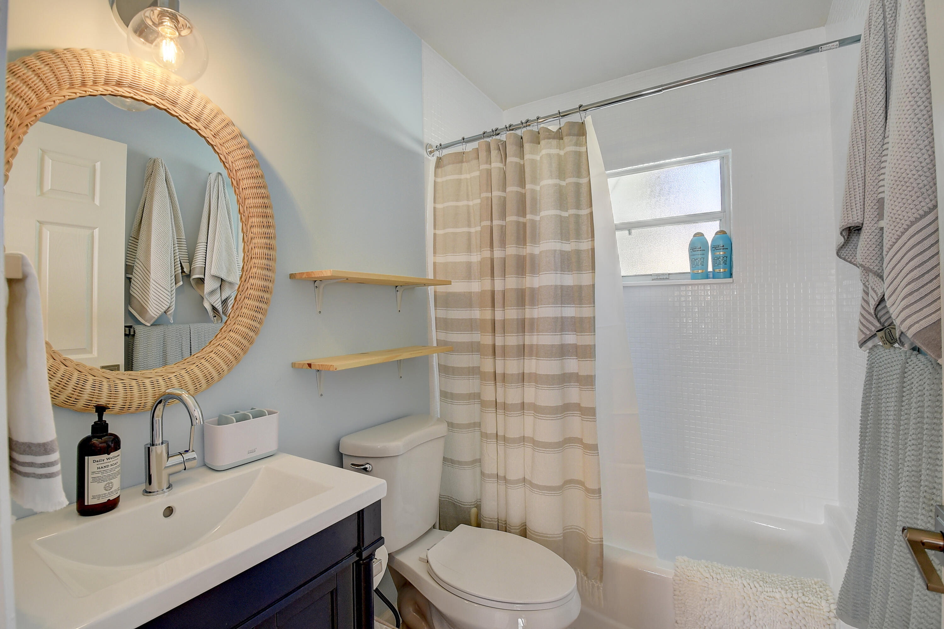 212 Southwest 1st Avenue Delray Beach, FL 33444 - Photo 13 of 15 a bathroom with a sink a toilet and shower