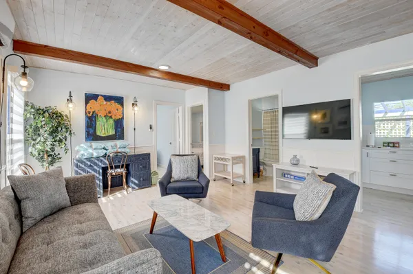 a living room with fireplace furniture and a flat screen tv