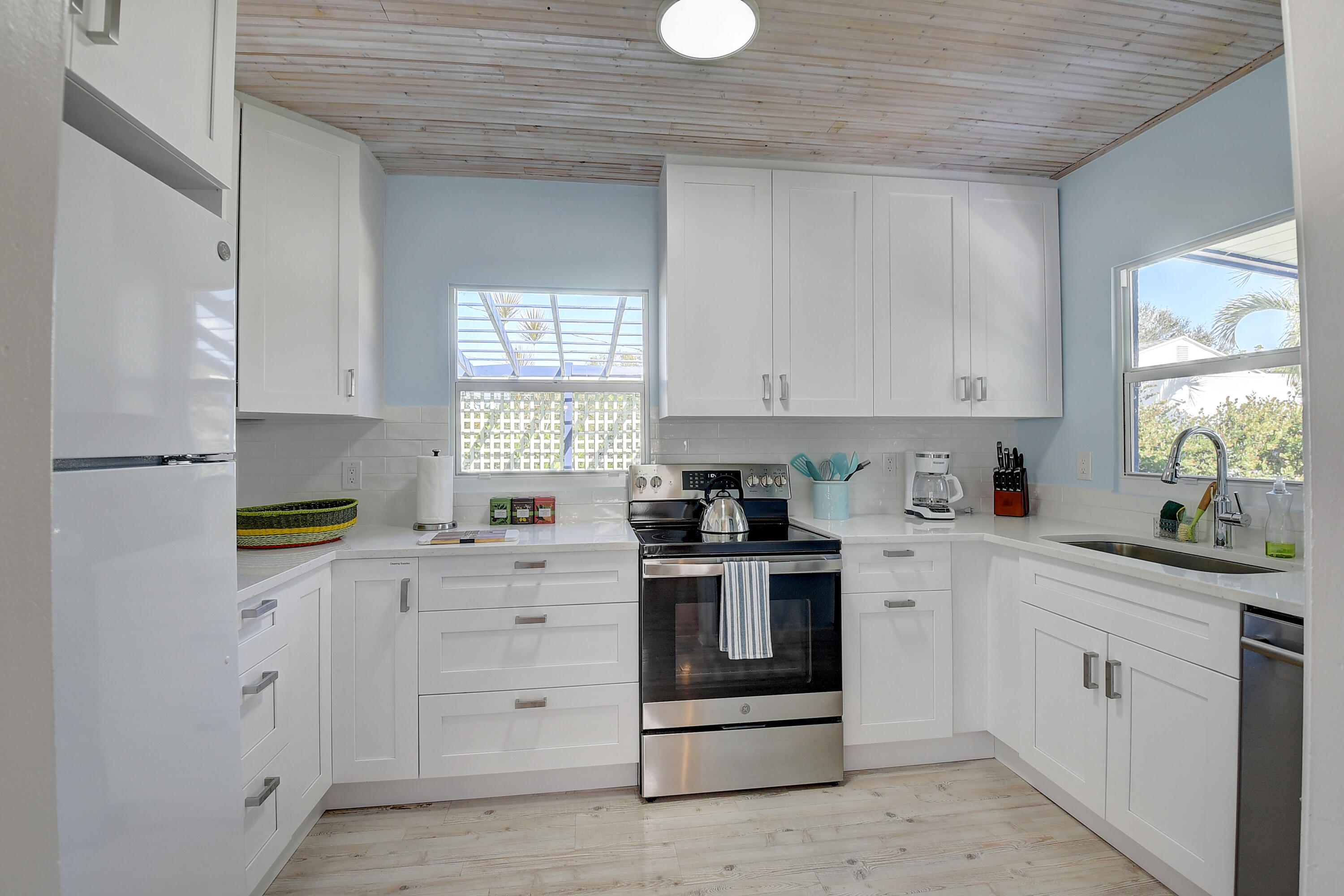 212 Southwest 1st Avenue Delray Beach, FL 33444 - Photo 9 of 15 a kitchen with cabinets appliances and a window