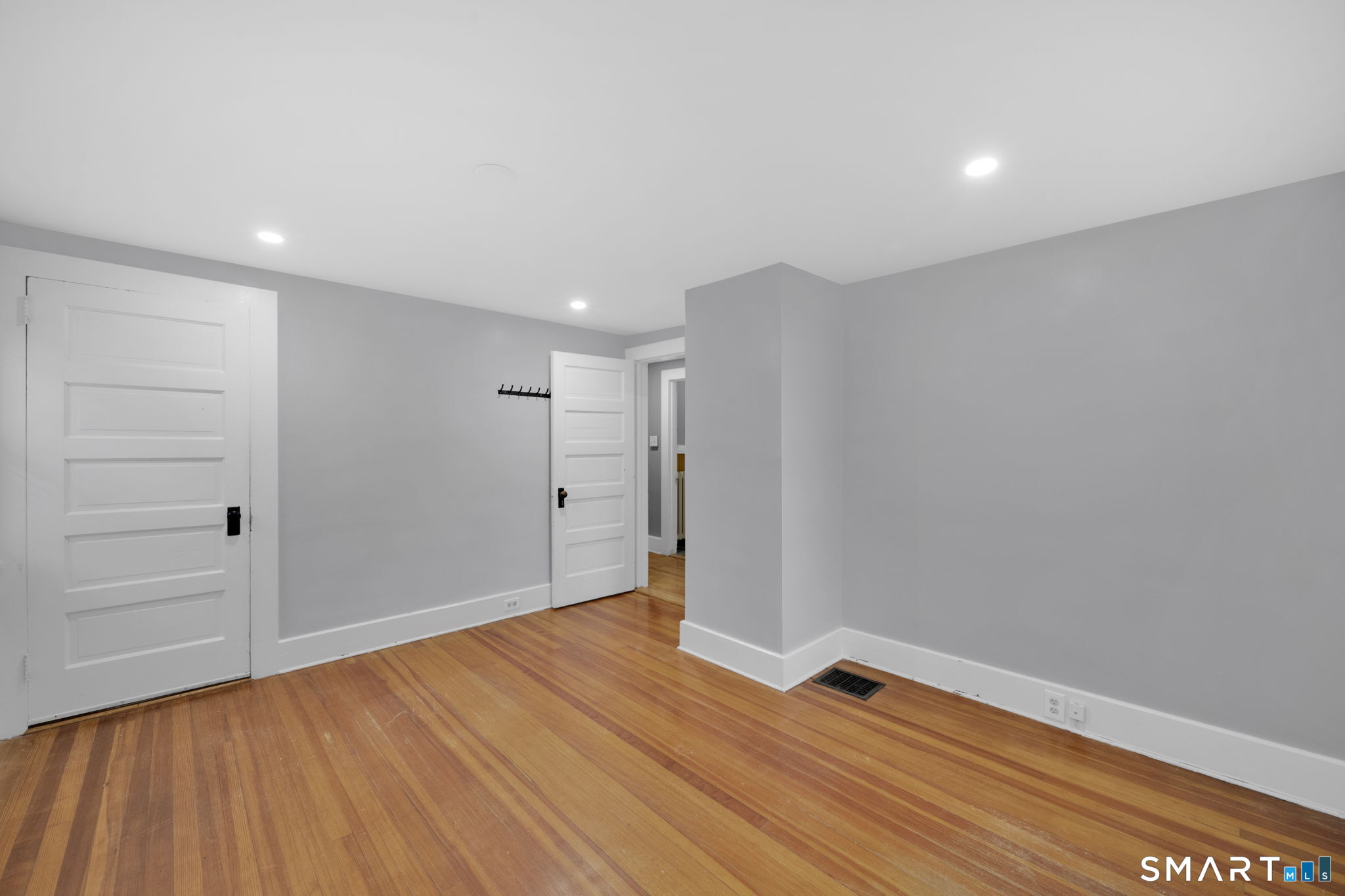 37 Bushy Hill Road Simsbury, CT 06070 - Photo 17 of 23 a view of an empty room with wooden floor