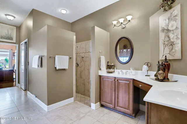a bedroom with furniture and a ceiling fan