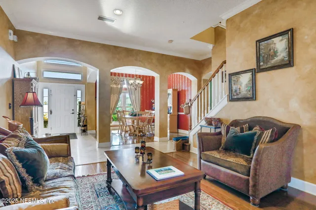 a living room with furniture and a rug