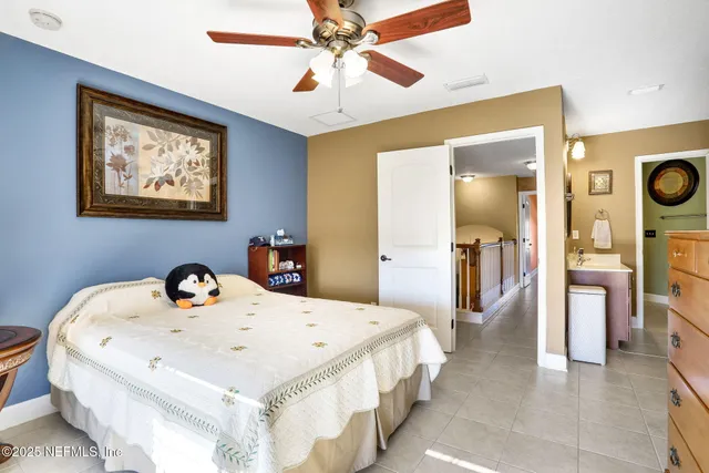 a view of pool with a table and chairs under an umbrella