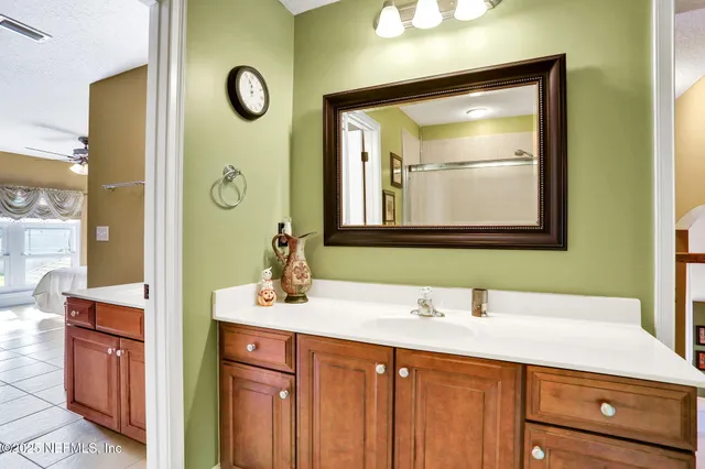 a view of a swimming pool with a garden and trees